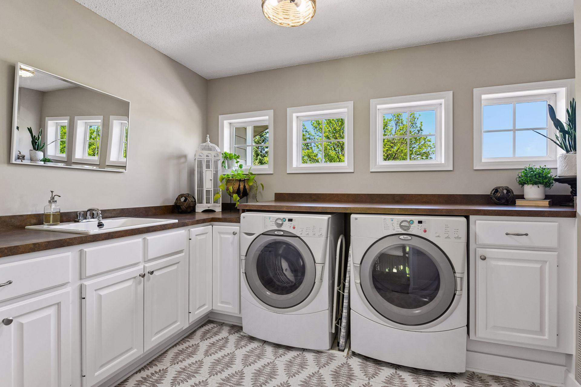Conveniently located on the upper level is the laundry room.