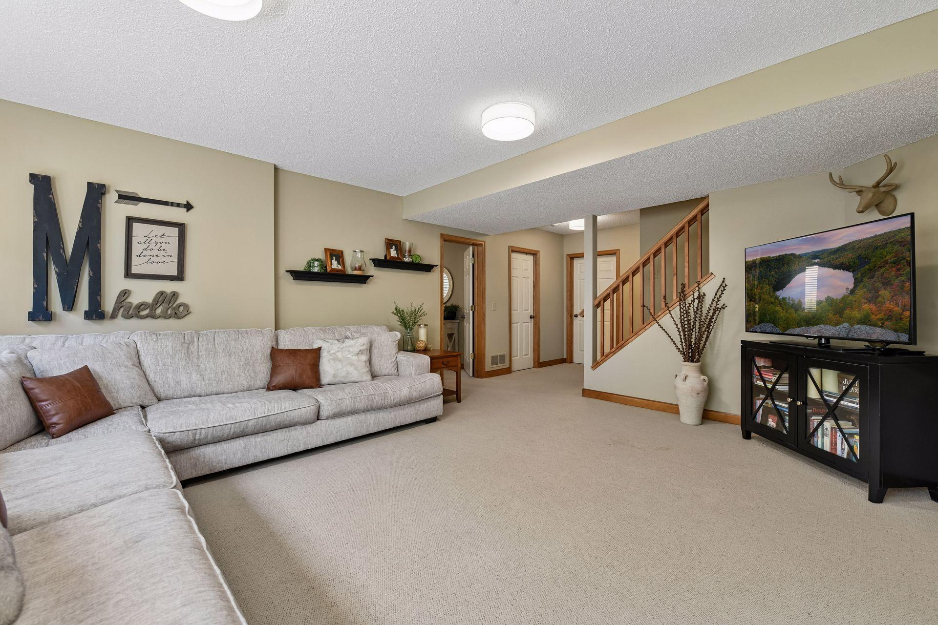 Downstairs, the lower level Family Room is a great space for movie night!