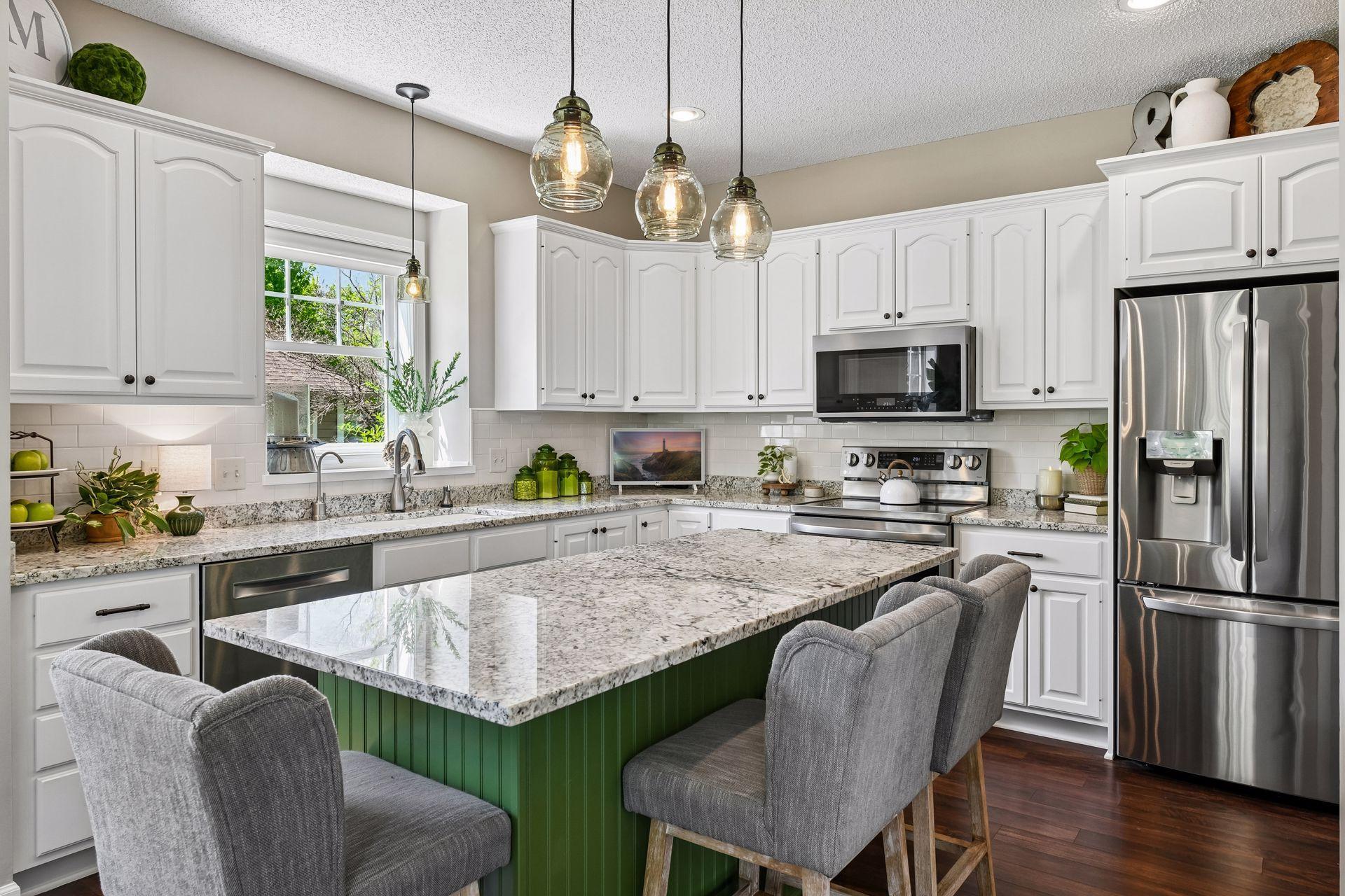 Beautifully refreshed, the Kitchen features granite countertops and new stainless steel appliances.