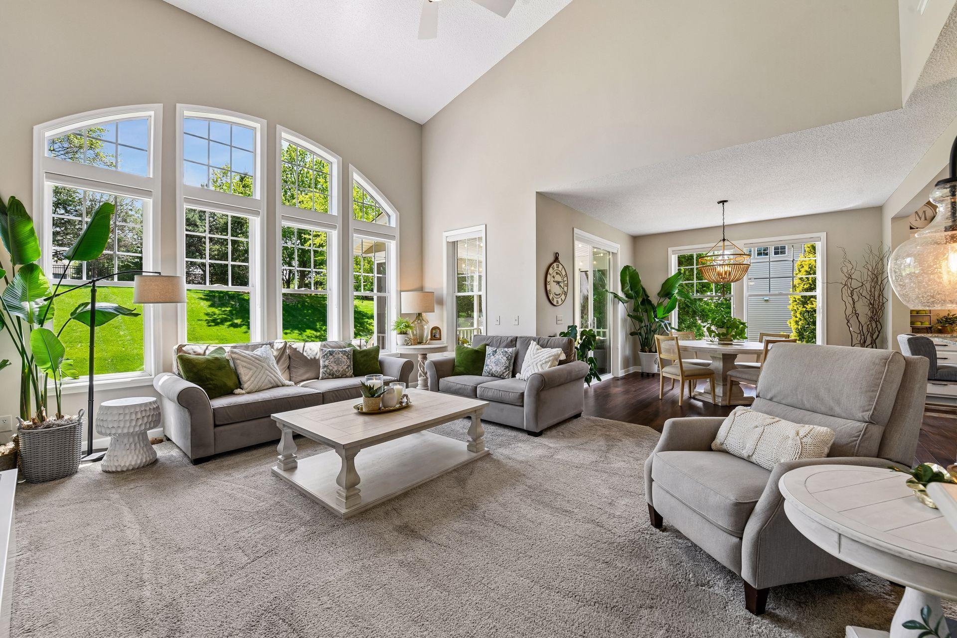 The large windows fill the space with natural light while providing views of the private backyard.