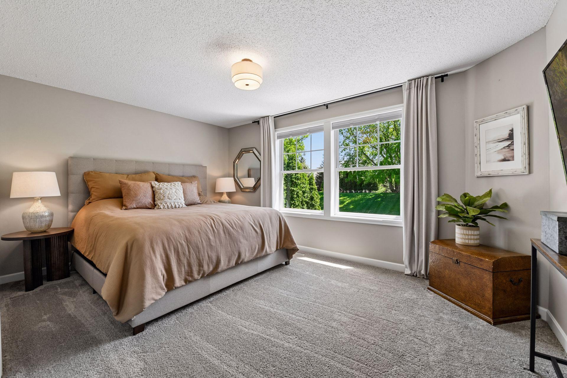 This spacious Bedroom enjoys views over the backyard.