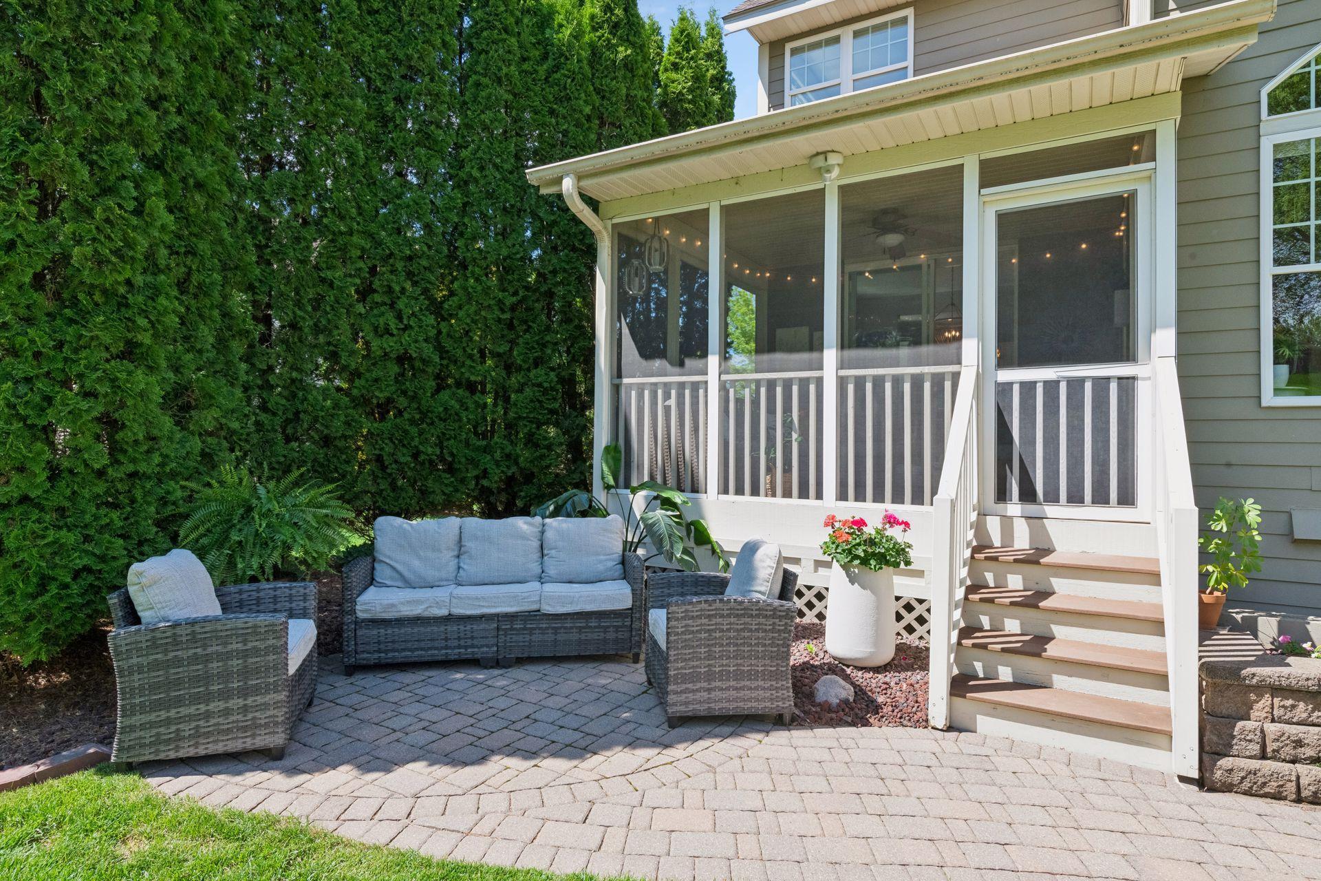 Professionally landscaped, the home is surrounded by lovely garden beds and custom paver patios.