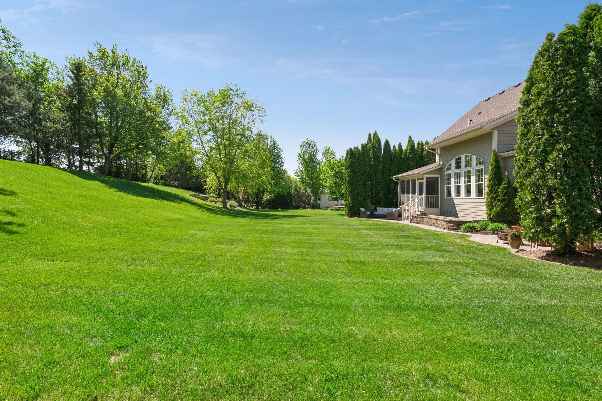 The gently sloping hill creates a private setting while also proving the ideal spot for a winter sledding hill!
