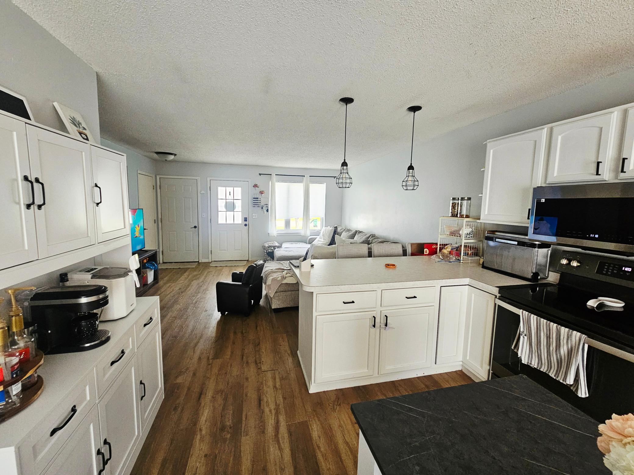 Kitchen looking into living room