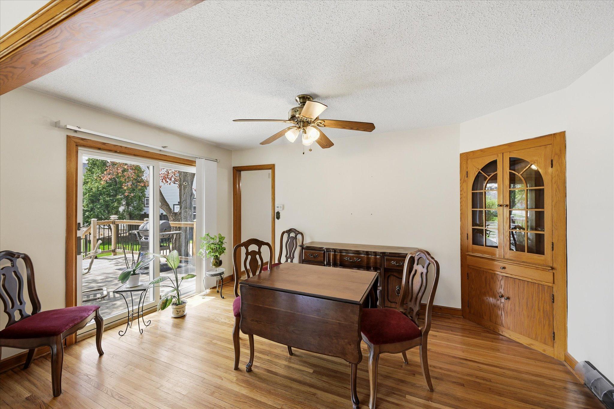 Formal dining room with built-in corner hutch. Sliding doors out to your deck