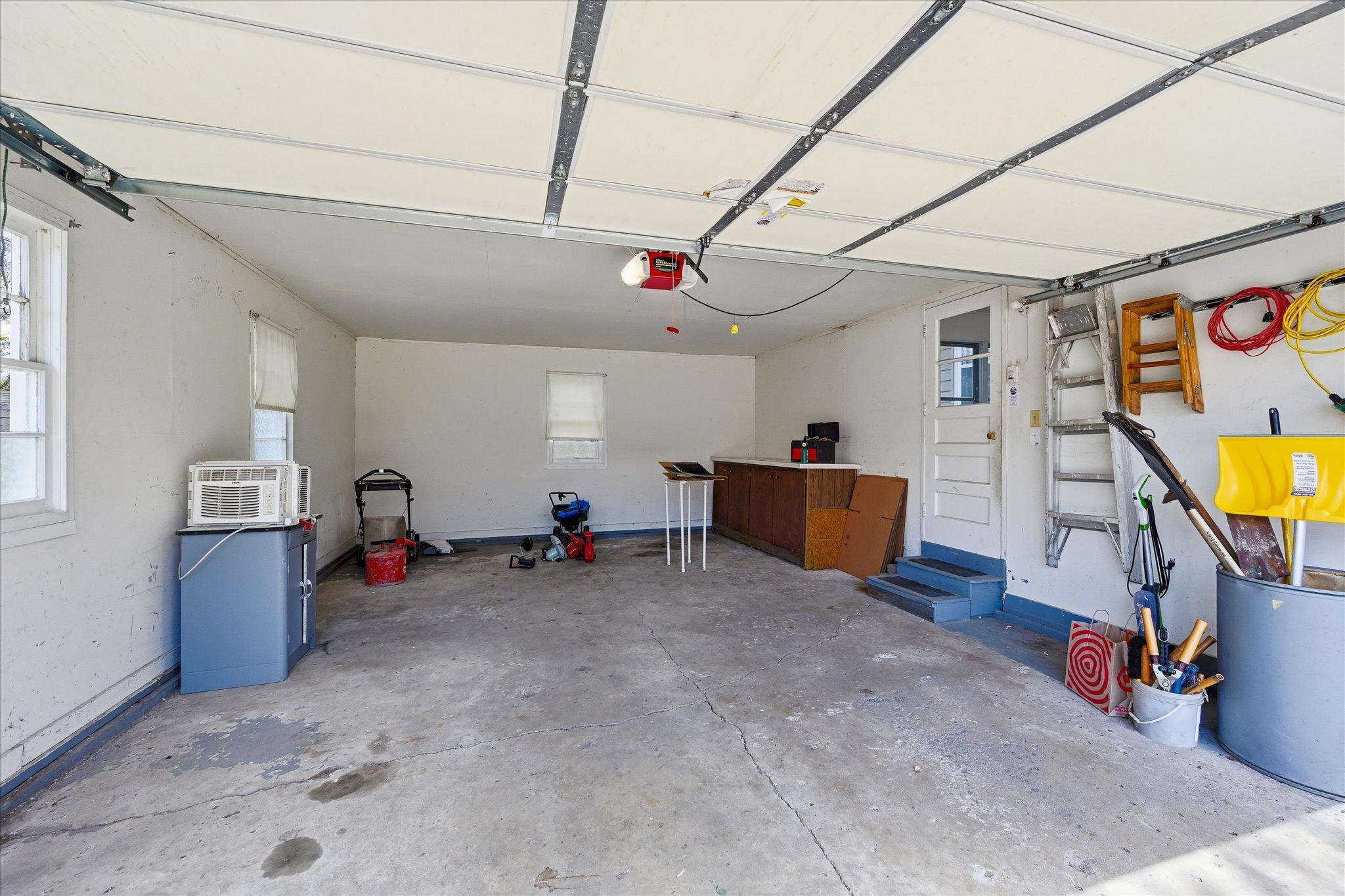 Finished 2 car attached garage has garage door opener