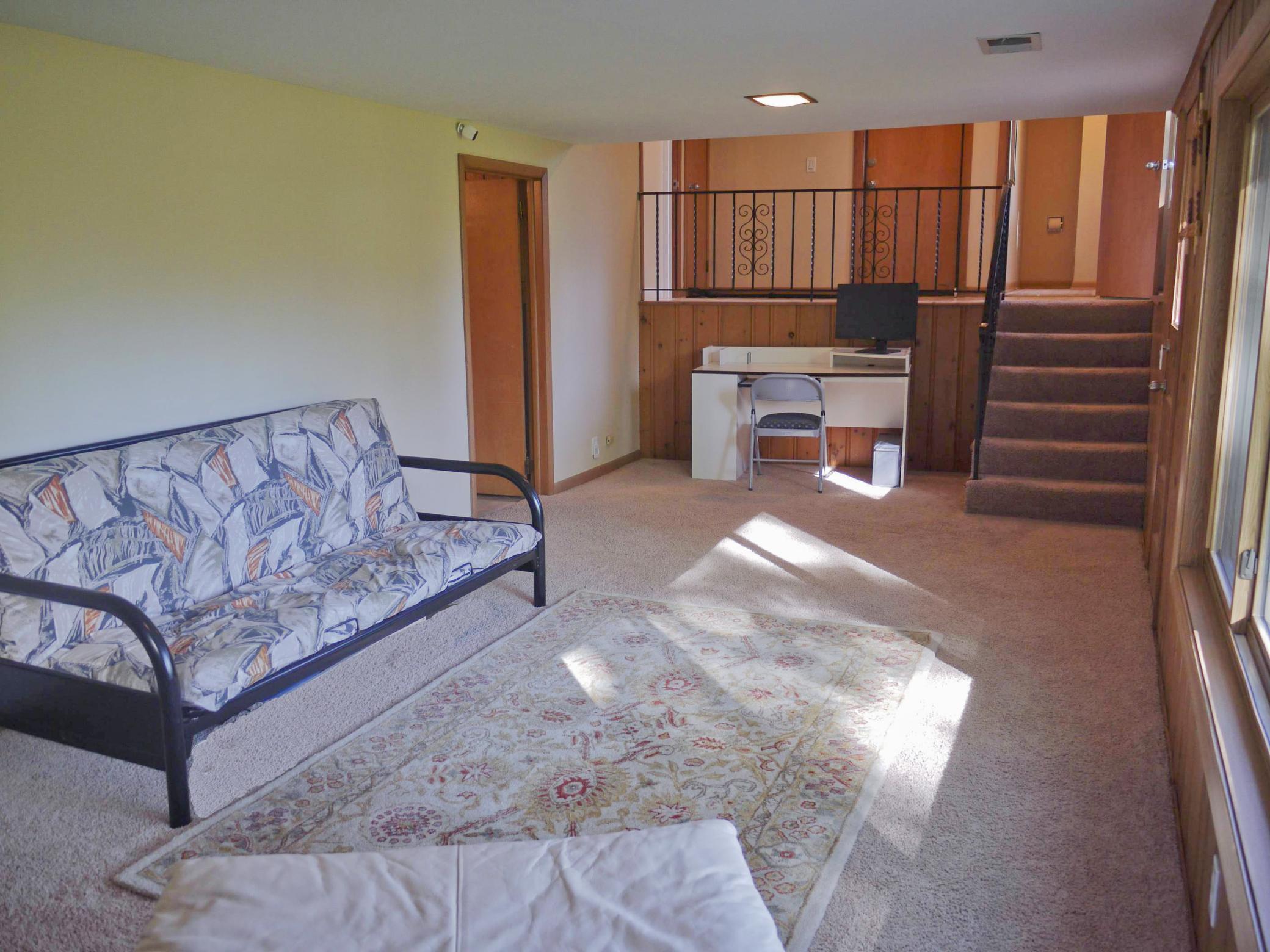 Alternate view of family room showing study nook and access to utility room.jpg