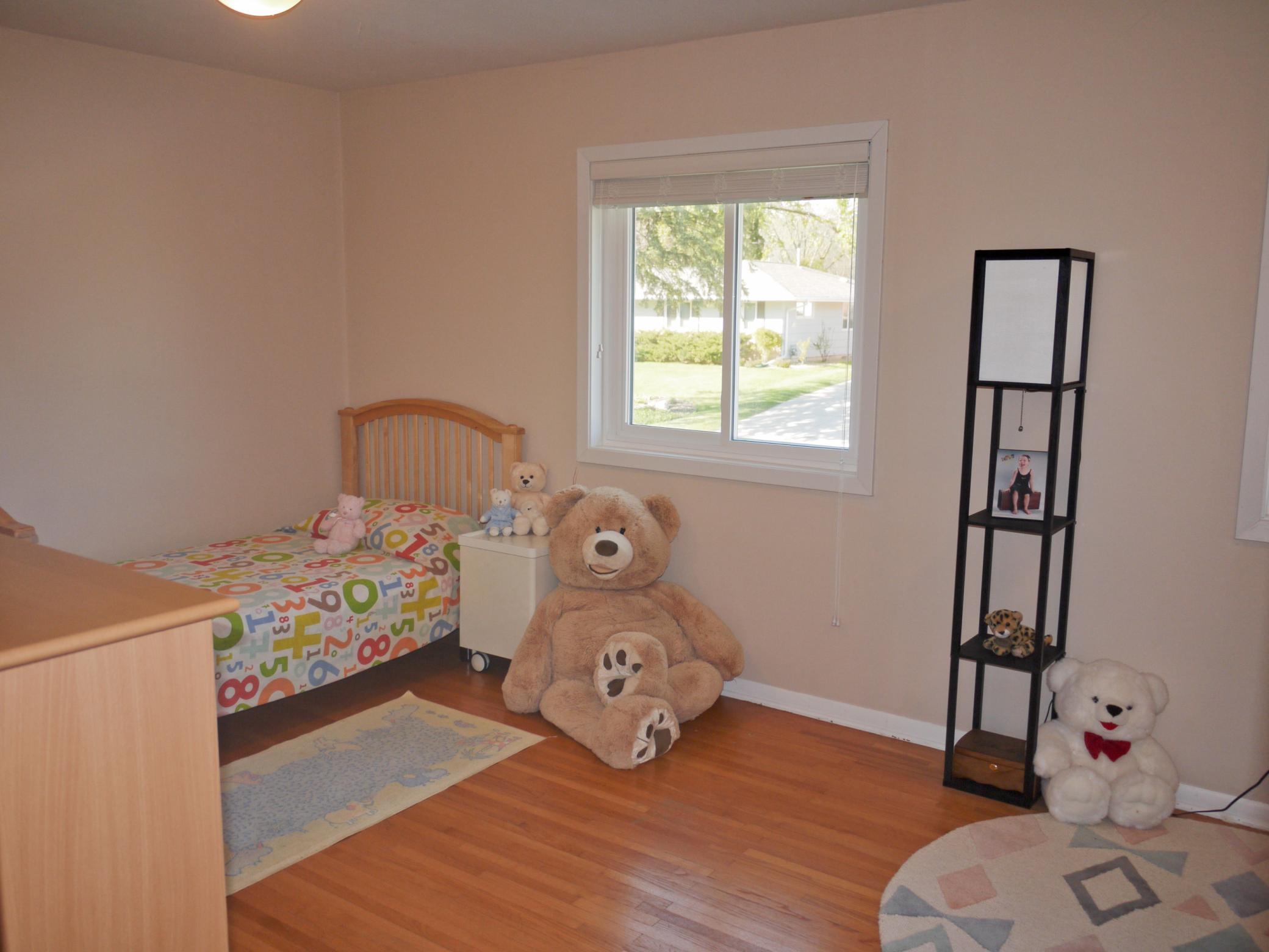 Second bedroom with 2 North facing windows and 2 closets - could easily be converted to 2 bedrooms.jpg