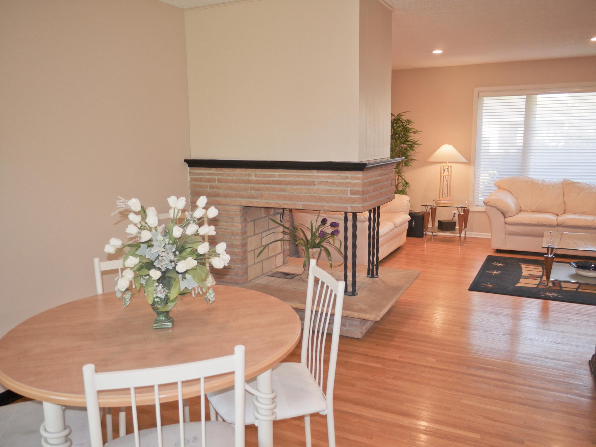 View from breakfast bar area across dining room into living room (1).jpg