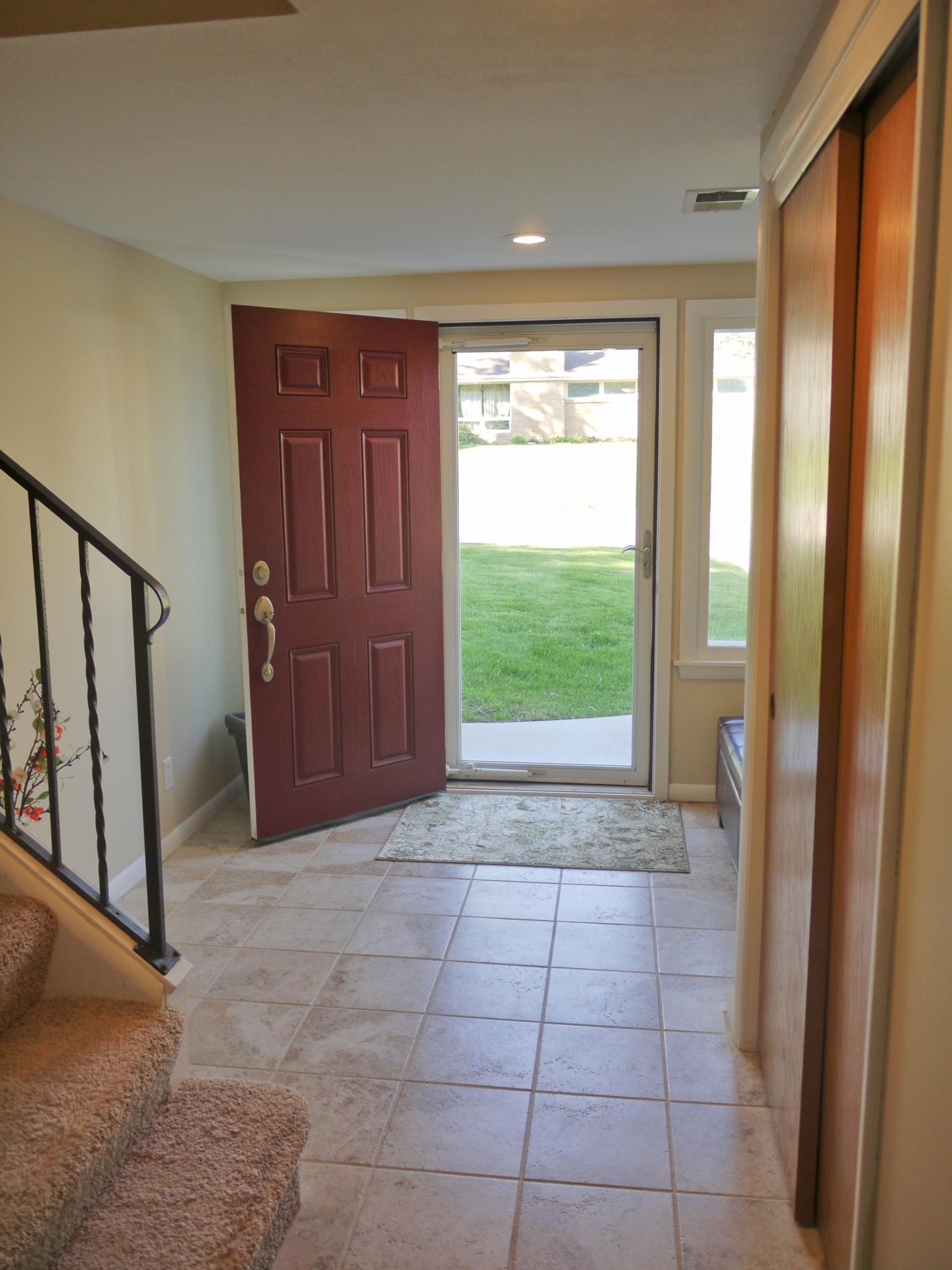 Generous entry foyer with large closet and bench area.jpg