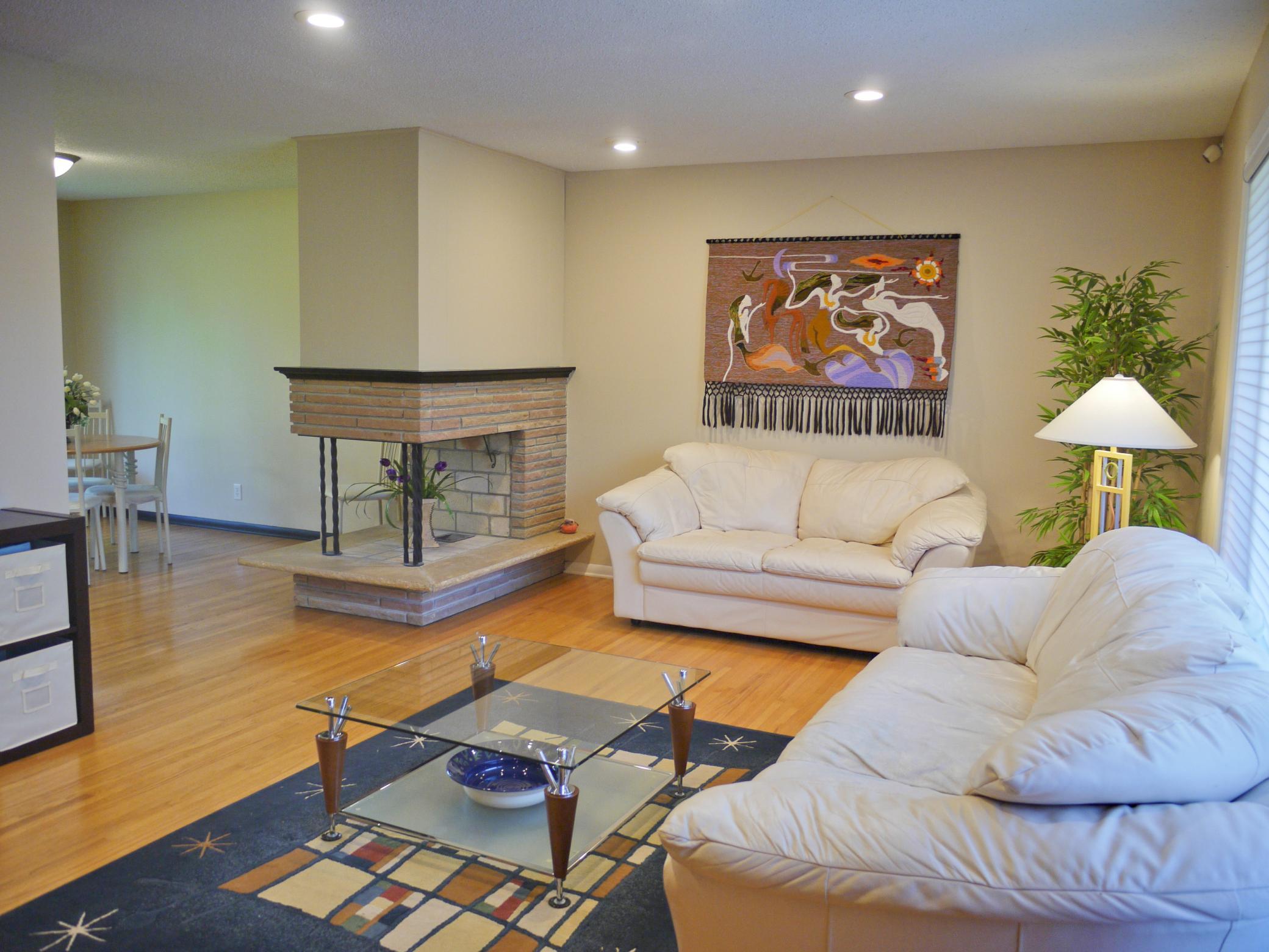 Cross view of living showing full fireplace and dining room entry.jpg