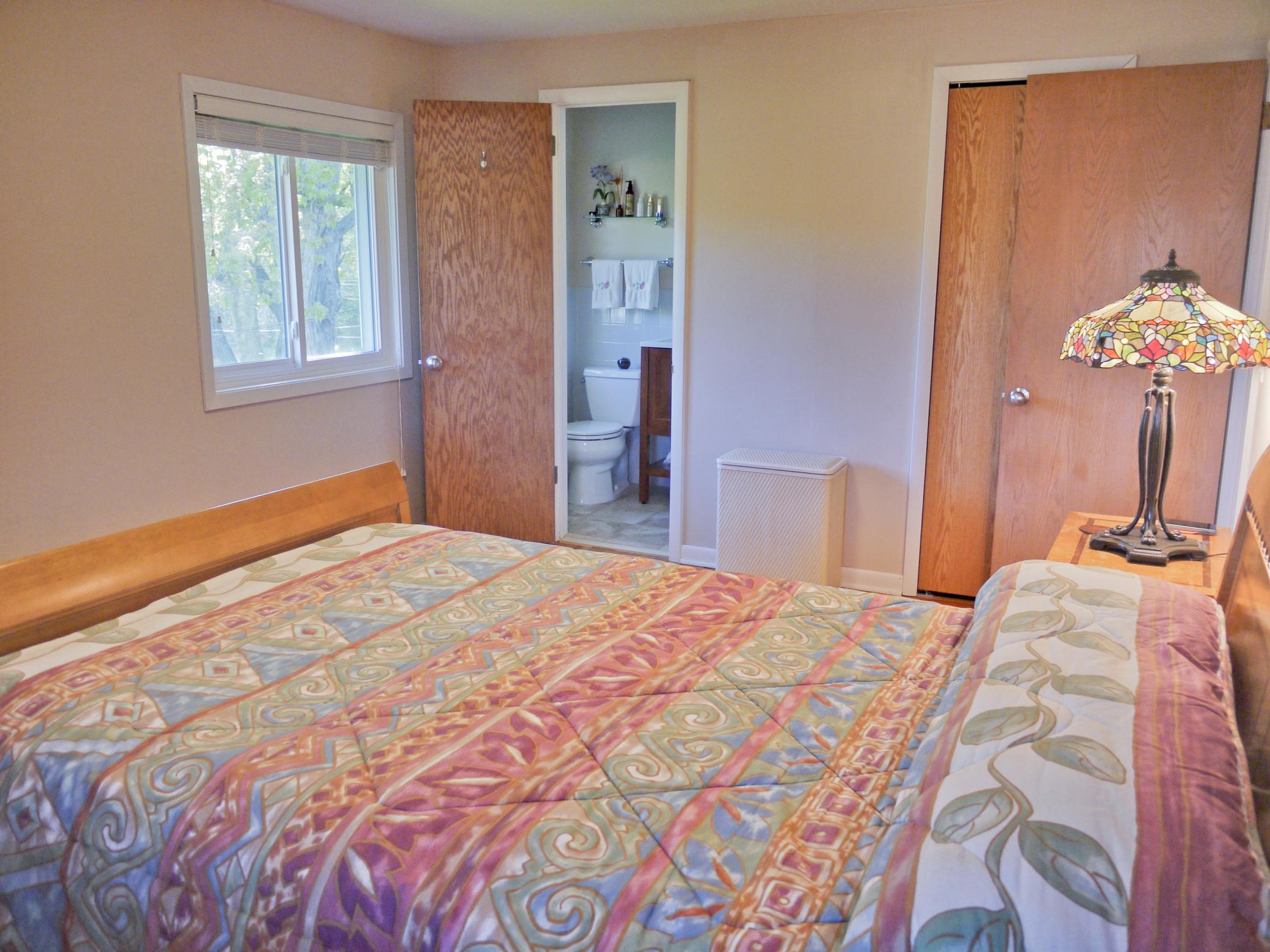 Additional view of owners suite showing South facing window overlooking yard and Nine Mile Creek.jpg