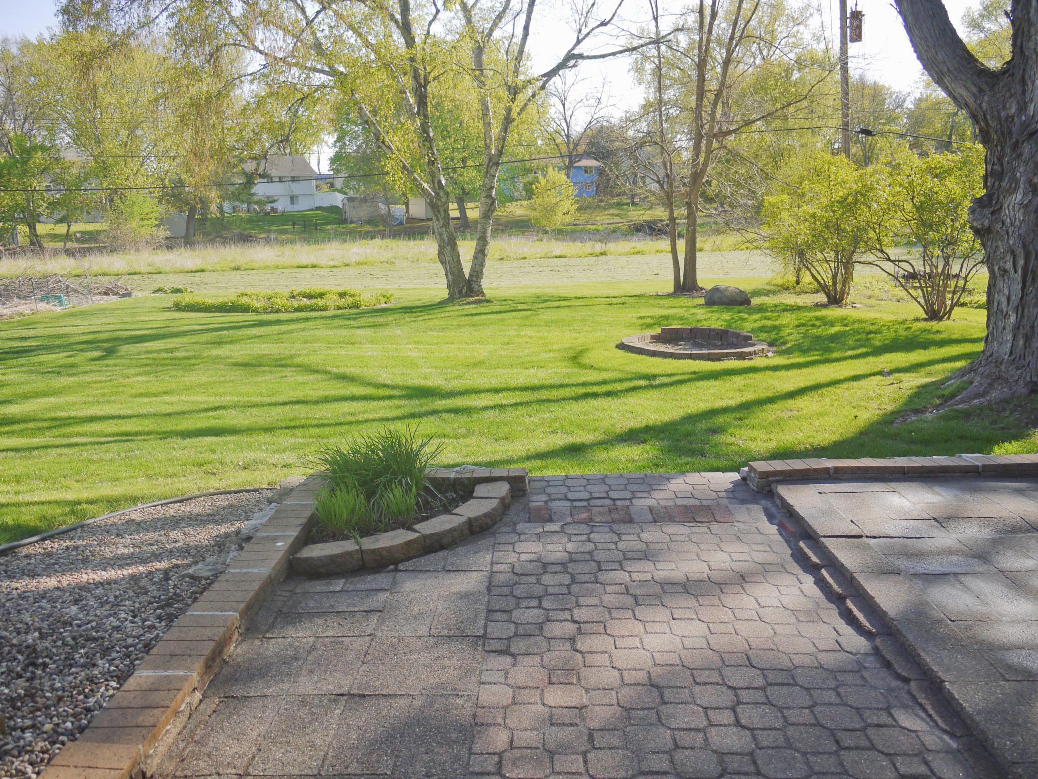 View from lower level walk-out overlooking rear yard and Nine Mile Creek.jpg