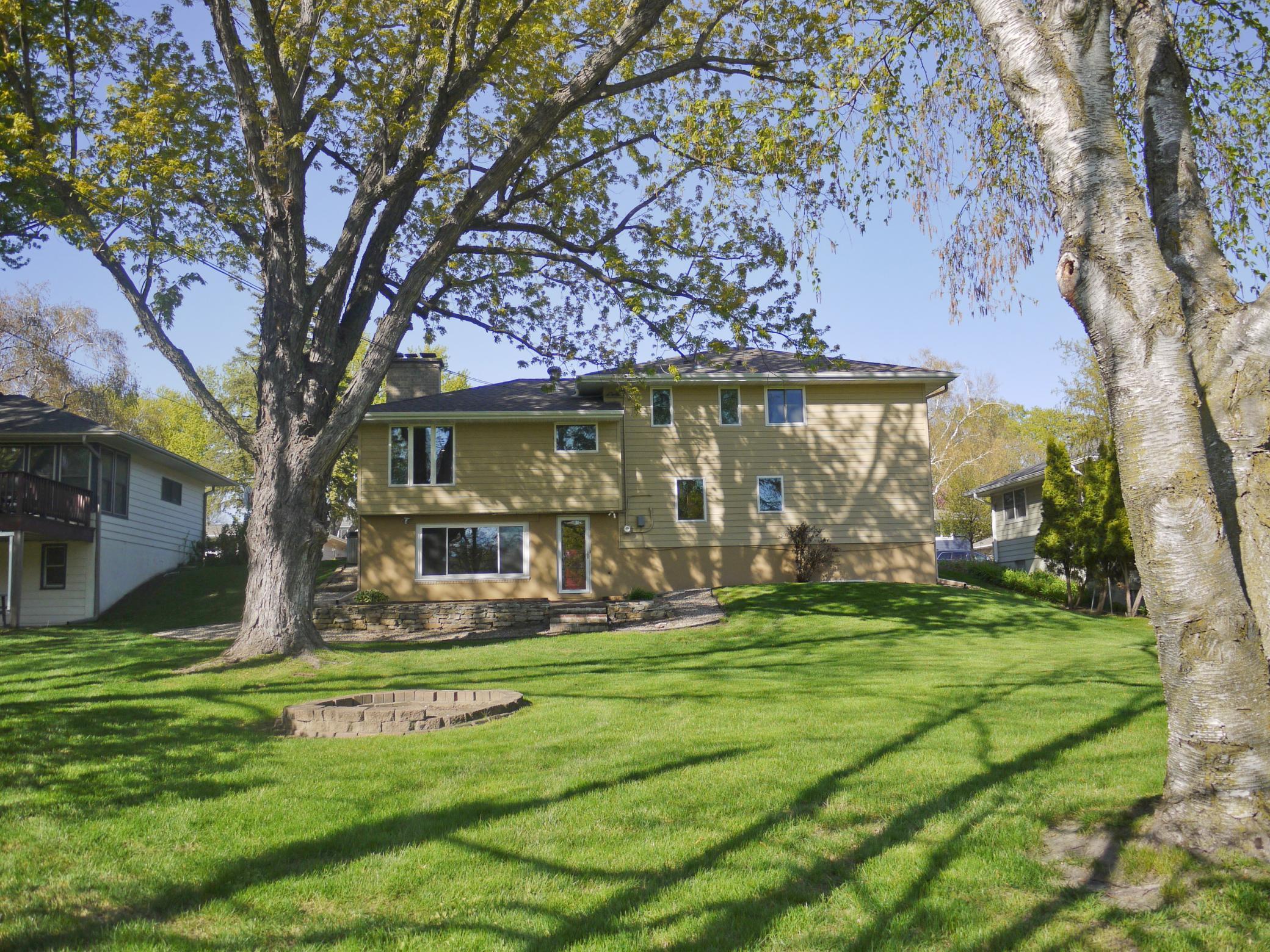 Rear view of property showing expansive yard and firepit area..jpg