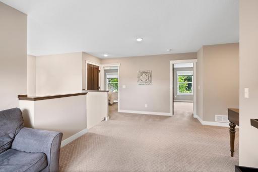 Lofted room could be an office or family room