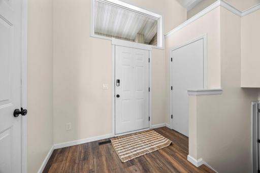 Soaring 13-foot ceilings give the foyer a bright, open feel from the moment you step inside.