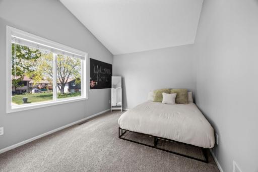 Front yard views pour natural light into this versatile, comfortable bedroom.