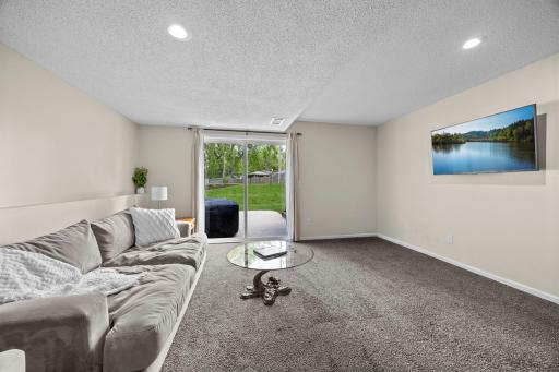 Walkout access connects this cozy family room directly to the new 2022 patio.