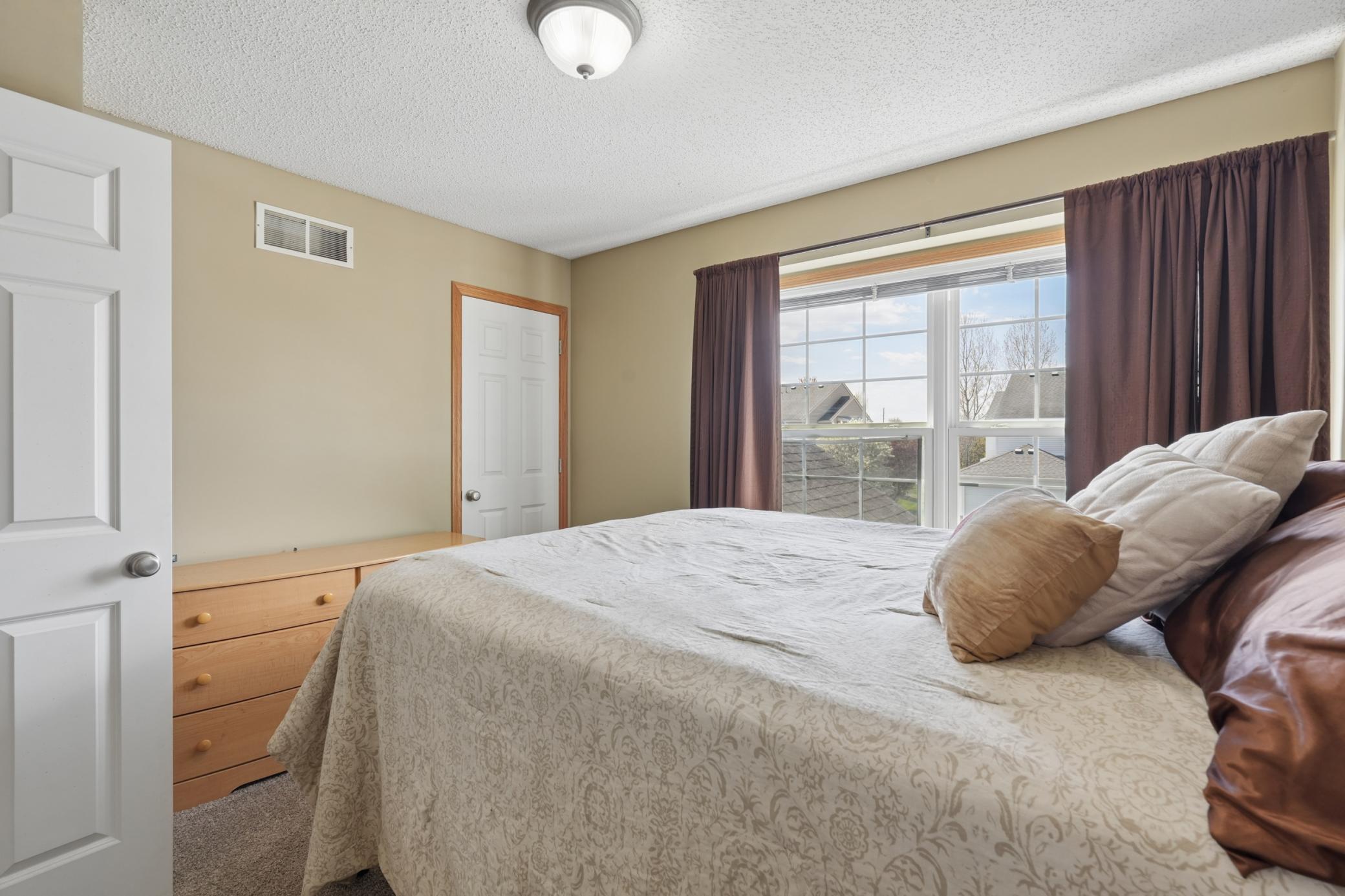 Another view of the second bedroom shows off all the extra light the large windows offer