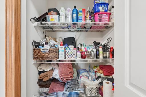 Upper level bath has a large linen closet