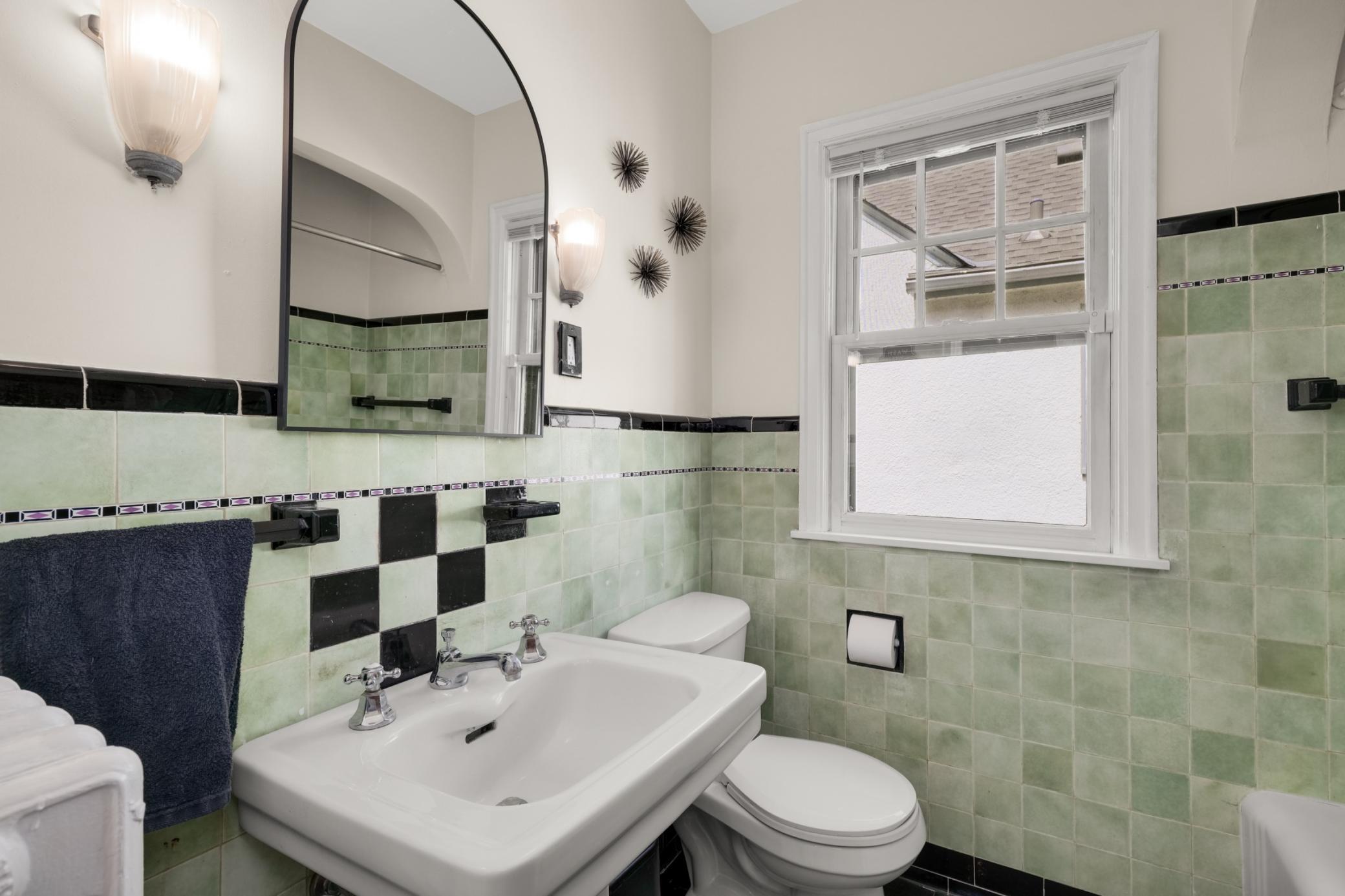 Main floor full bath with original glass tile