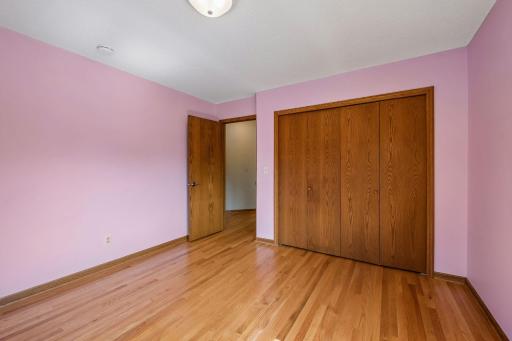 3rd bedroom on upper-level, got to love all the beautiful hardwood floors