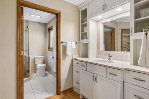 Primary bath with plenty of cabinets and storage