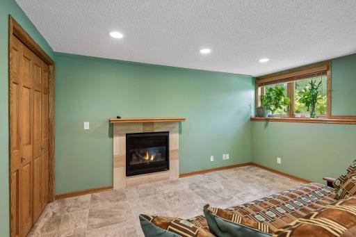 Handsome gas fireplace a great place to snuggle on movie night
