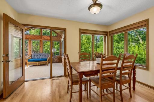 Eat-in kitchen flanked by 3 /4 season porch