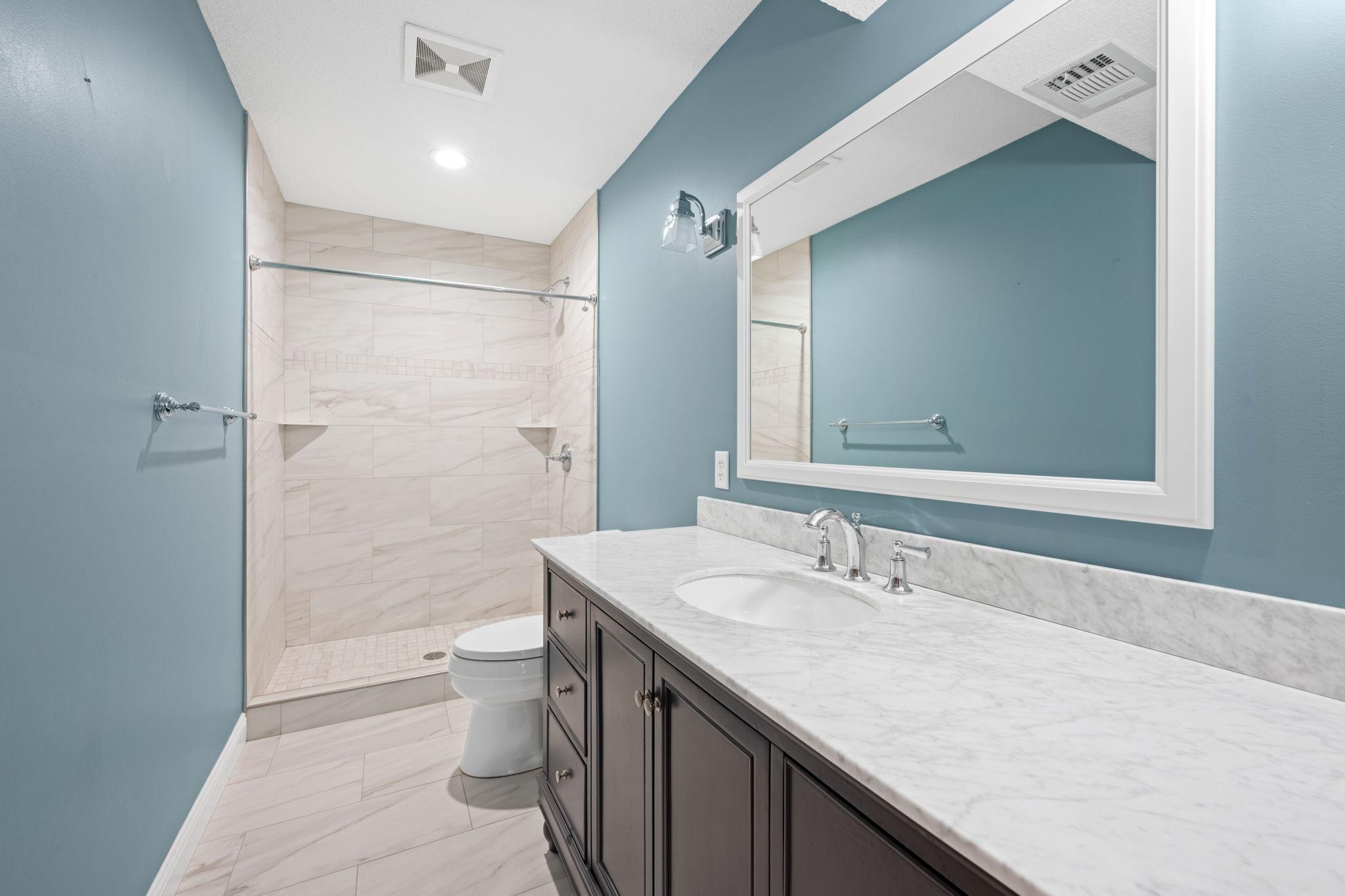 Stunning lower level 3/4 bath with tiled shower!