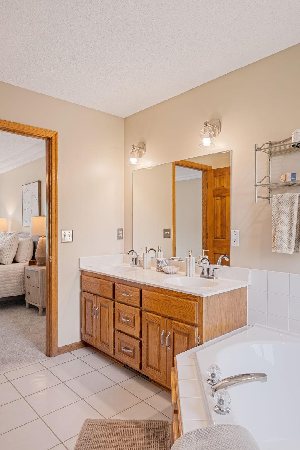 Dual vanities, large jetted tub & walk-in shower--you'll feel like your at the spa!