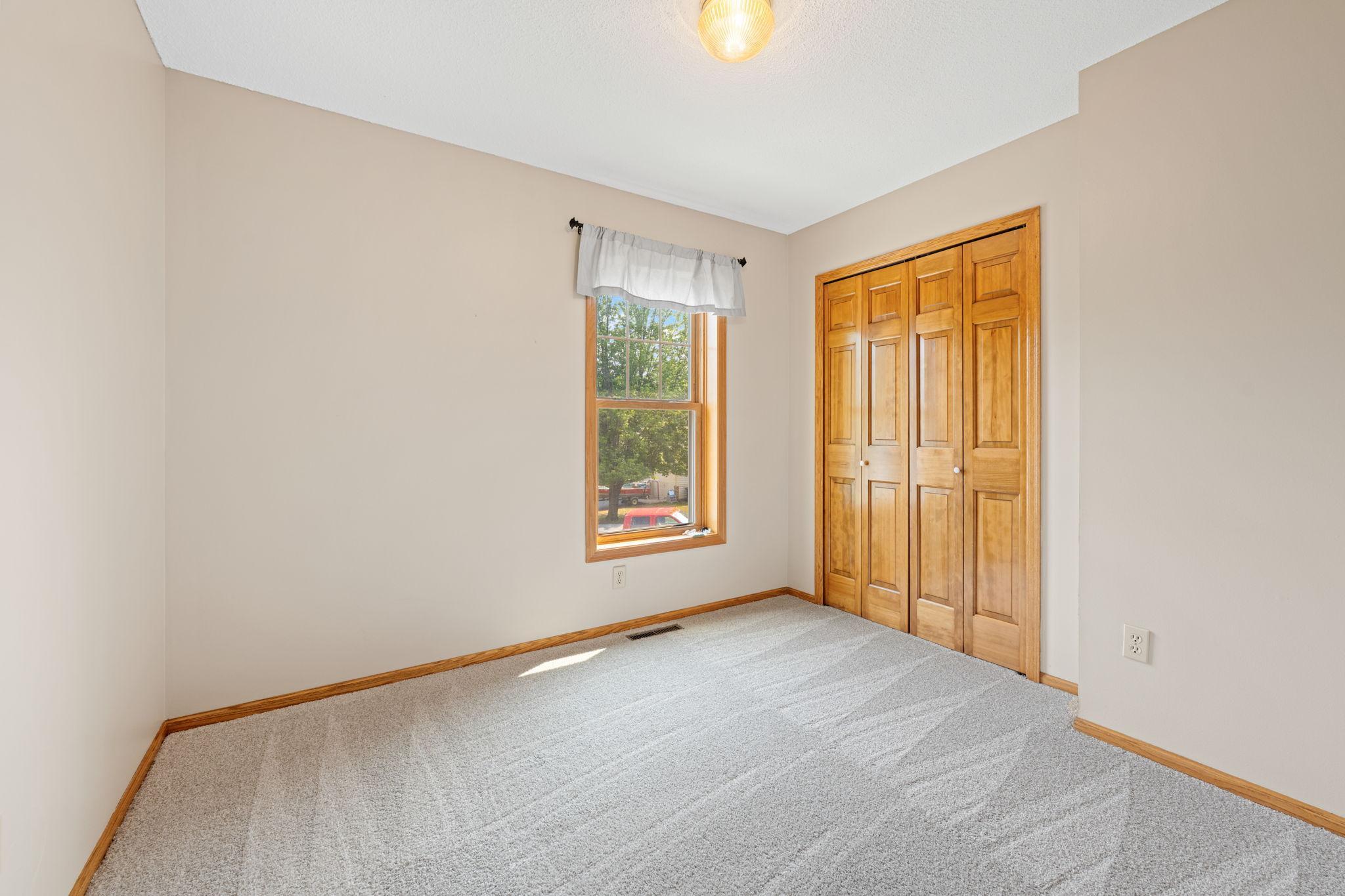 Three generous additional bedrooms and a full bath complete the upper level.