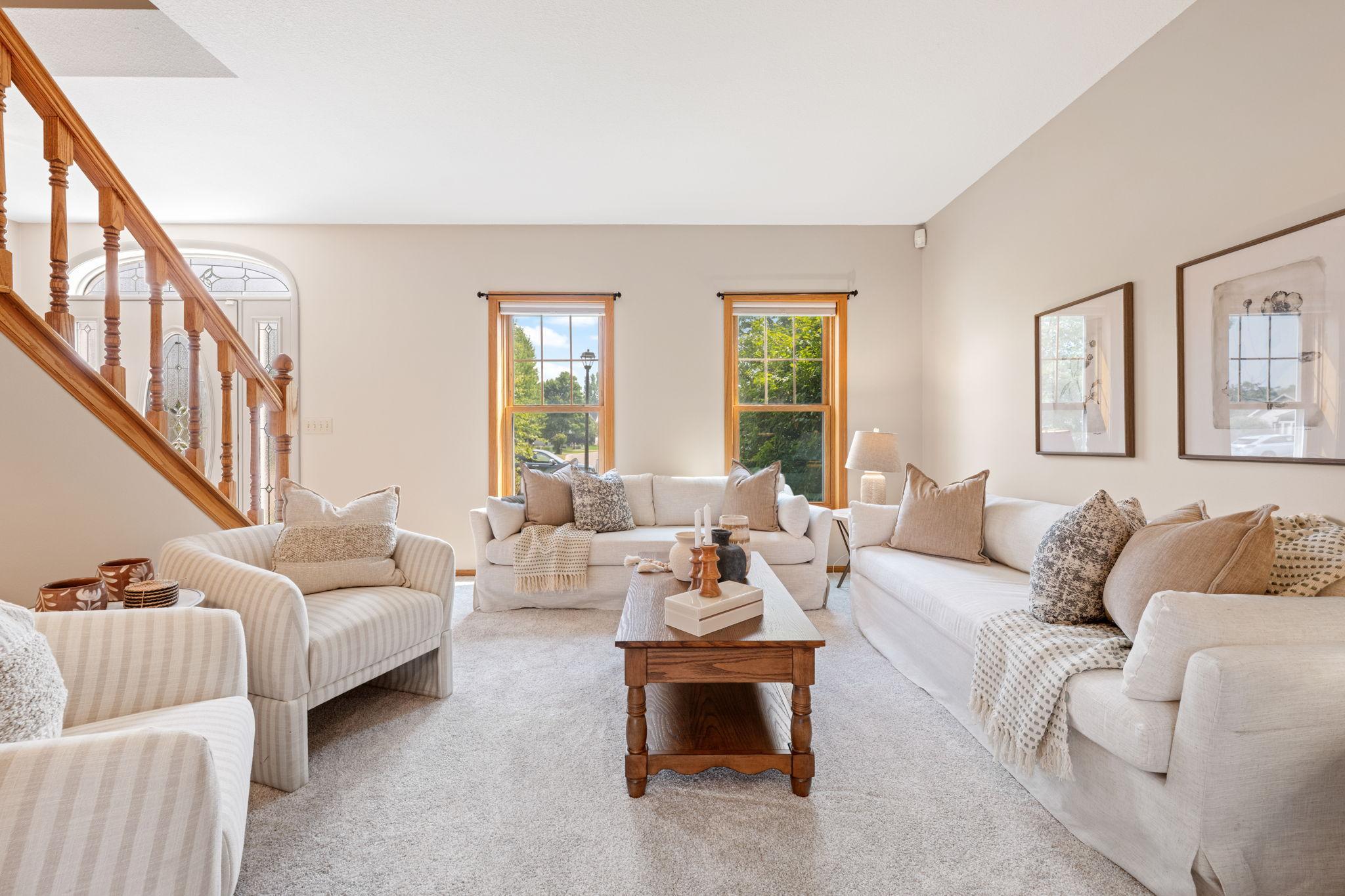 Large windows flood the main level with natural light.