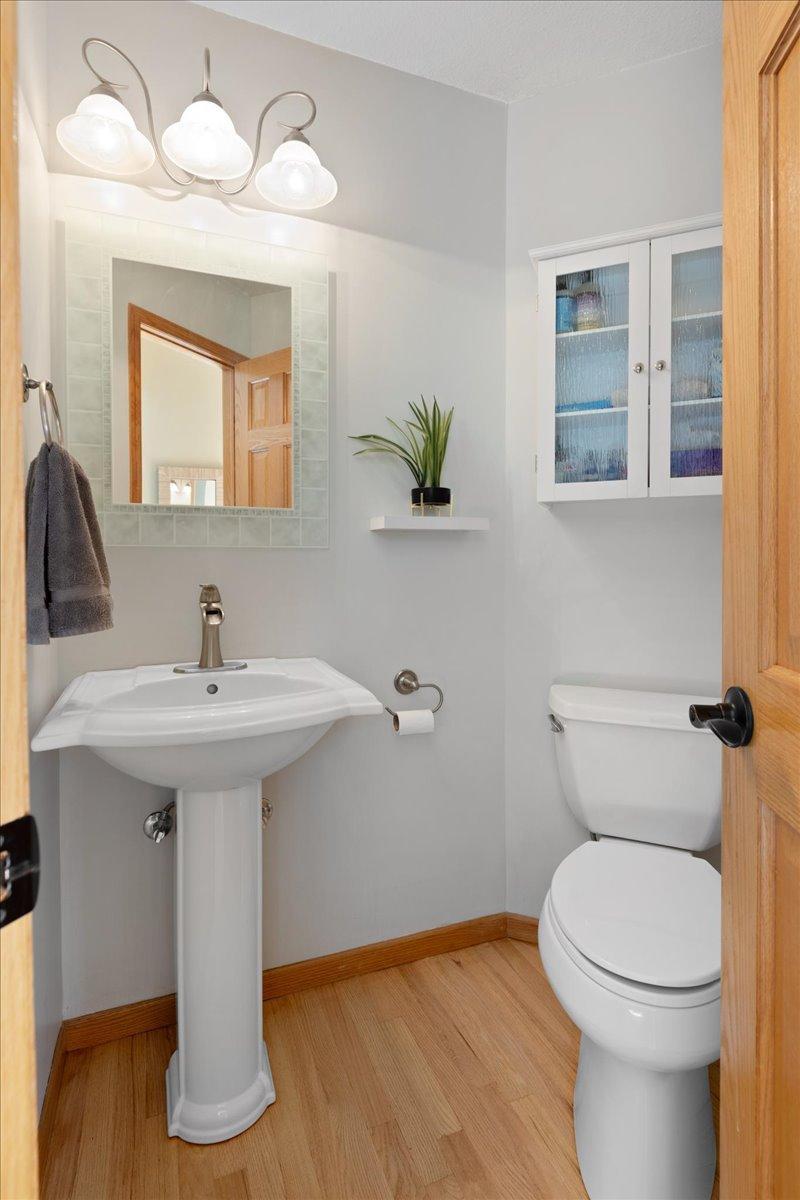 Powder room just off the kitchen and Foyer