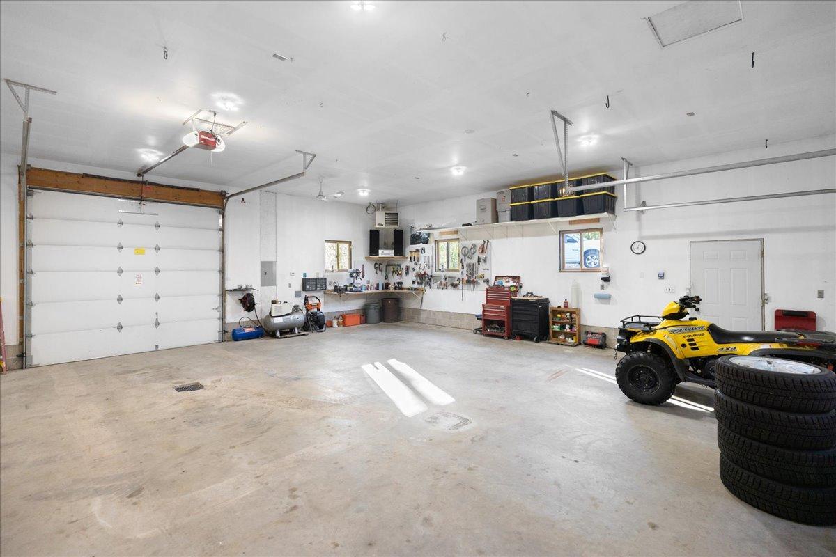 Expansive Detached Garage with 10 Foot Front Overhead Door and Floor Drain System