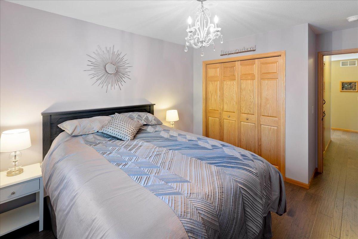 Bright Secondary Bedroom with wood floors