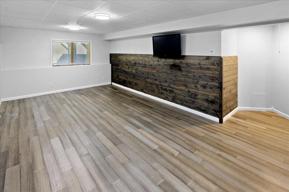 Versatile Basement Living Area with Modern Flooring 62-062.jpg