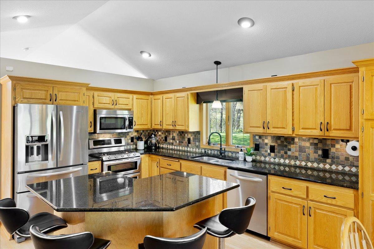 Granite countertops and ceramic tile backsplash
