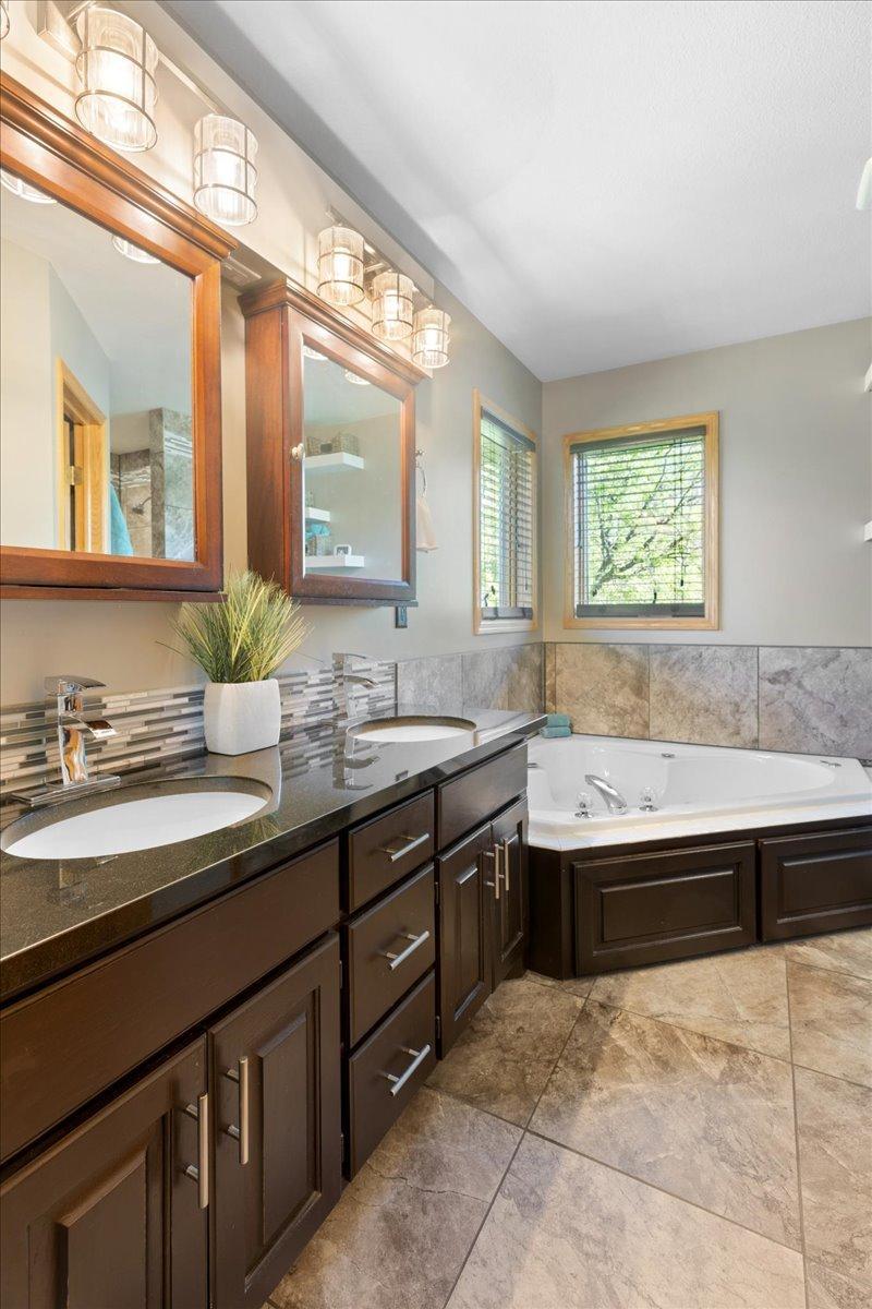 4Elegant Bathroom with Soaking Tub and Tile Finishes 9-049.jpg