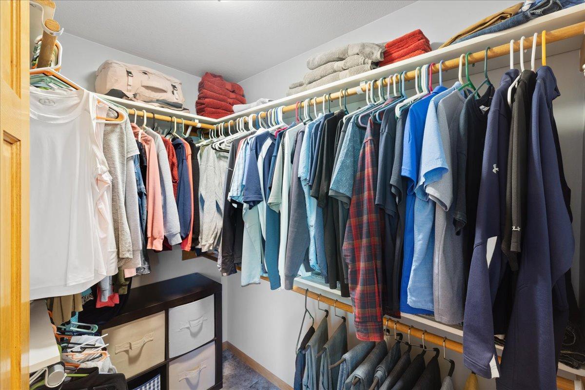 Organized Walk-In Closet with Ample Hanging Space 53-053.jpg