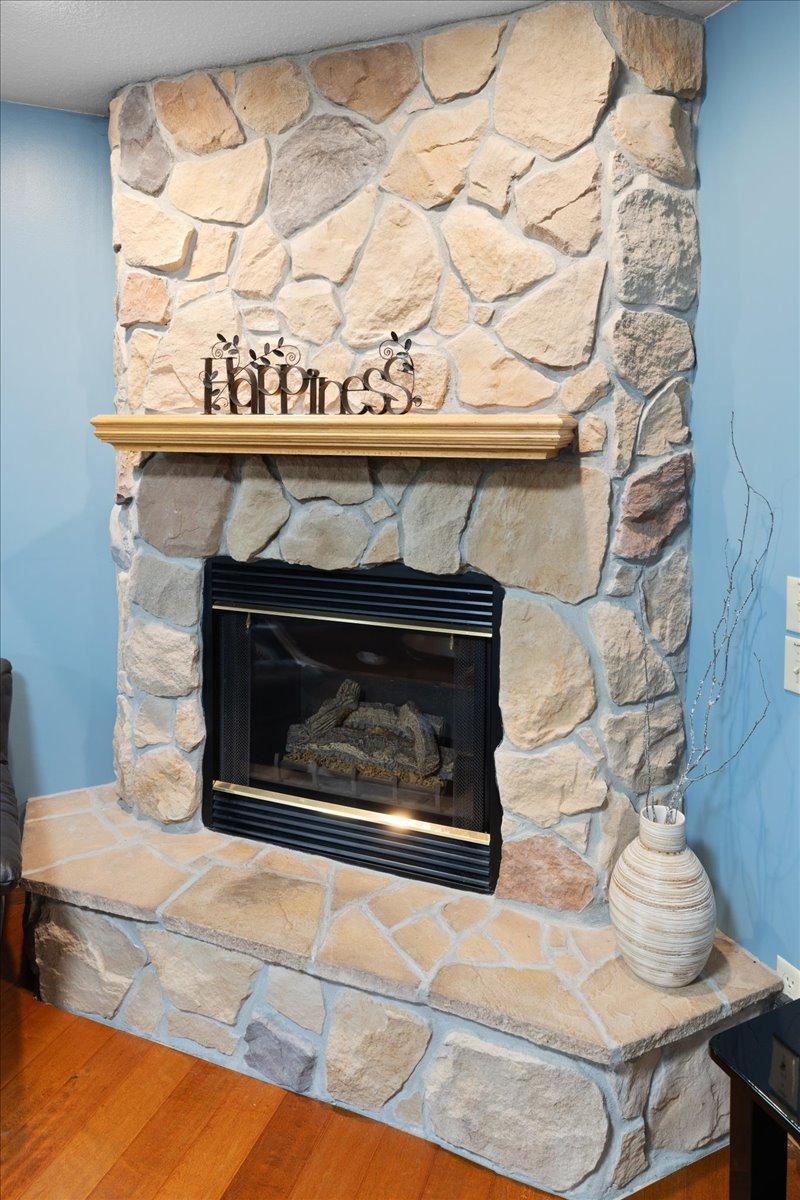 Cozy Gas Fireplace with Stone Surround