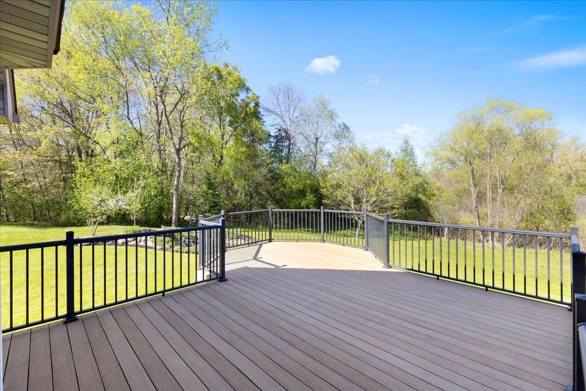 Expansive Composite Deck Overlooking Backyard 56-056.jpg