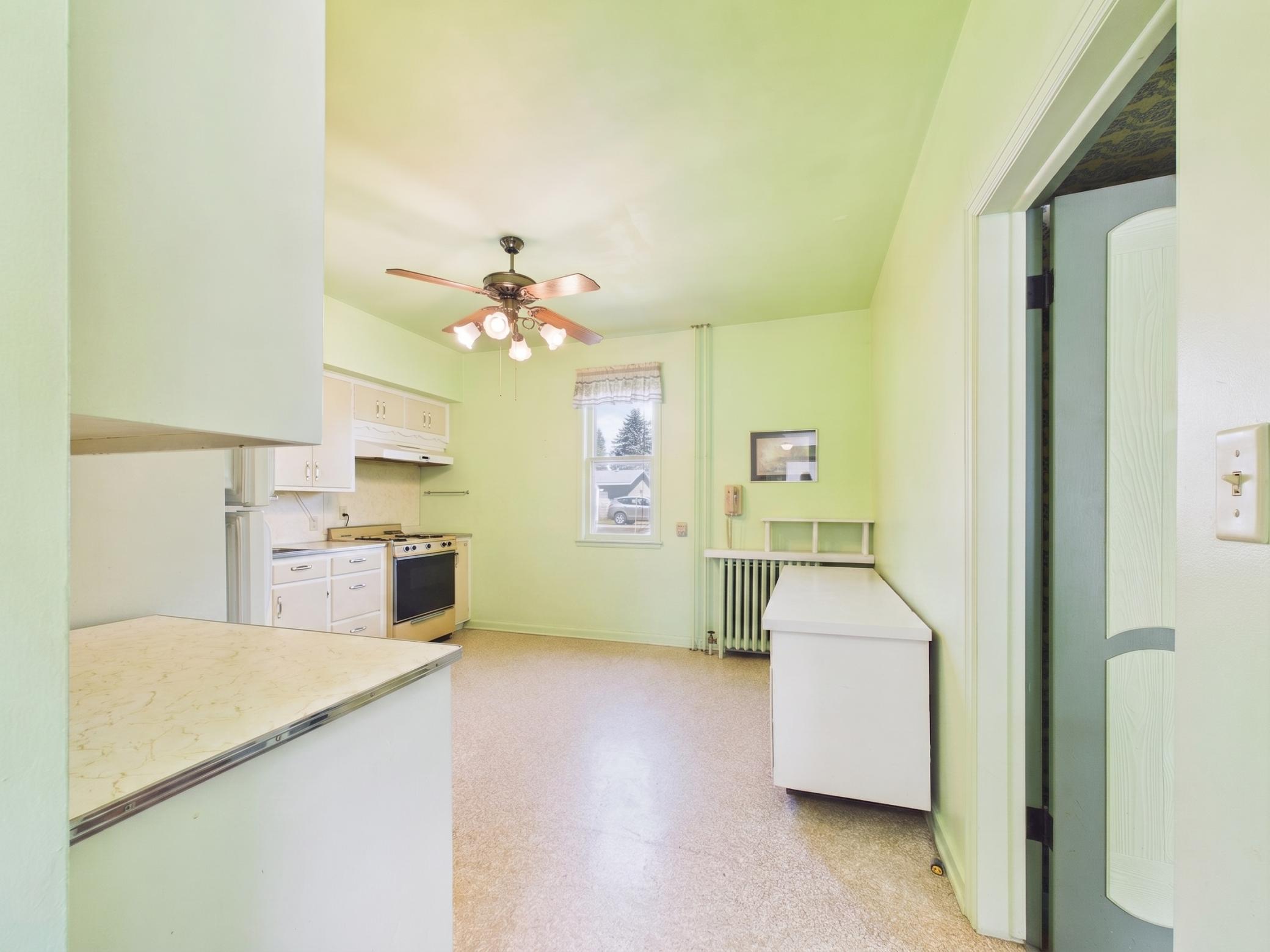 Additional kitchen angle showing layout and access.