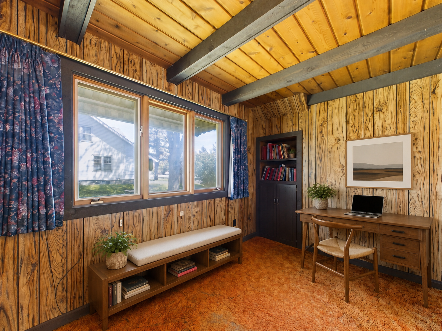 Cozy den virtually staged as a home office or reading space.