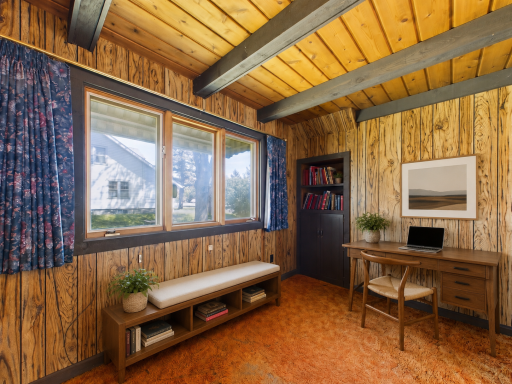 Cozy den virtually staged as a home office or reading space.