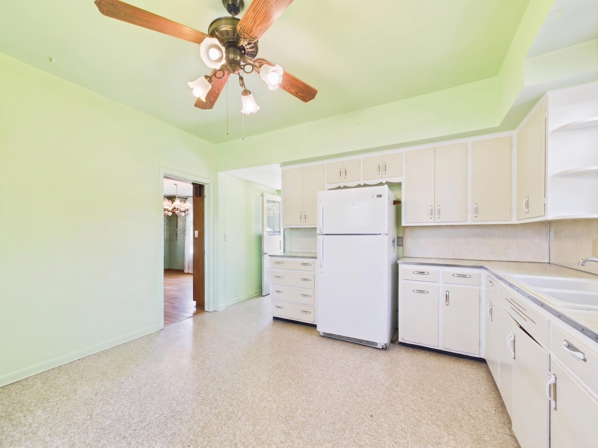 Functional kitchen ready for future updates and personal touches.