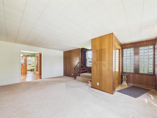 Spacious living room with tall ceilings and original character.