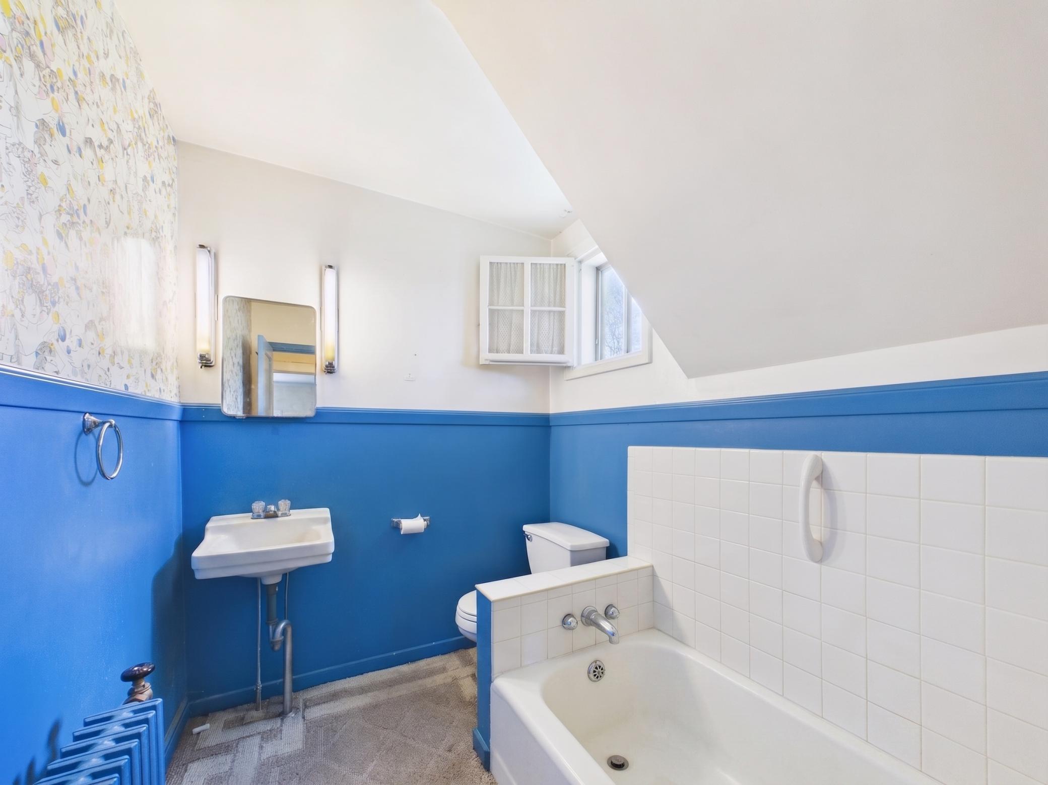 Upper-level bathroom with vintage style and update potential.