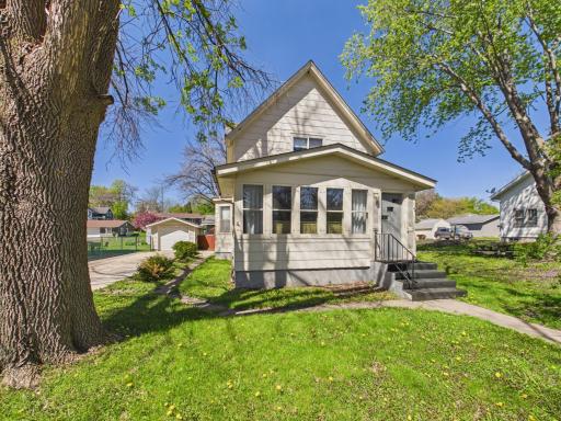 Turn-of-the-century charm with inviting curb appeal and mature trees.