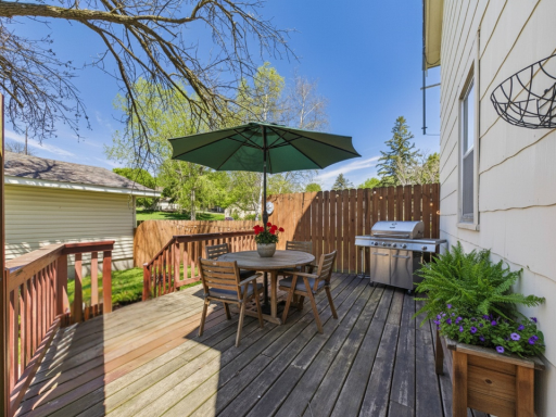 Backyard deck with space to relax, grill, or enjoy the outdoors.virtually staged to show layout potential.